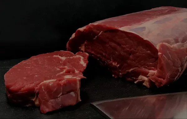 A beef joint being cut on the bench at the Countrystyle Meats butchers counter in Lancaster
